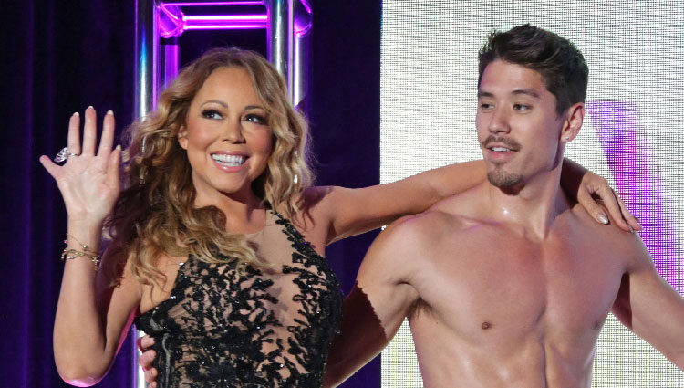 Mariah Carey y el bailarín Bryan Tanaka en un evento