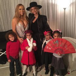 Beyoncé y Mariah Carey con sus hijos en un concierto