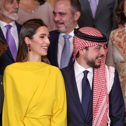 Hussein de Jordania y Rawja Al Saif, muy sonrientes en la boda de Iman de Jordania y Jameel Alexander Thermiotis