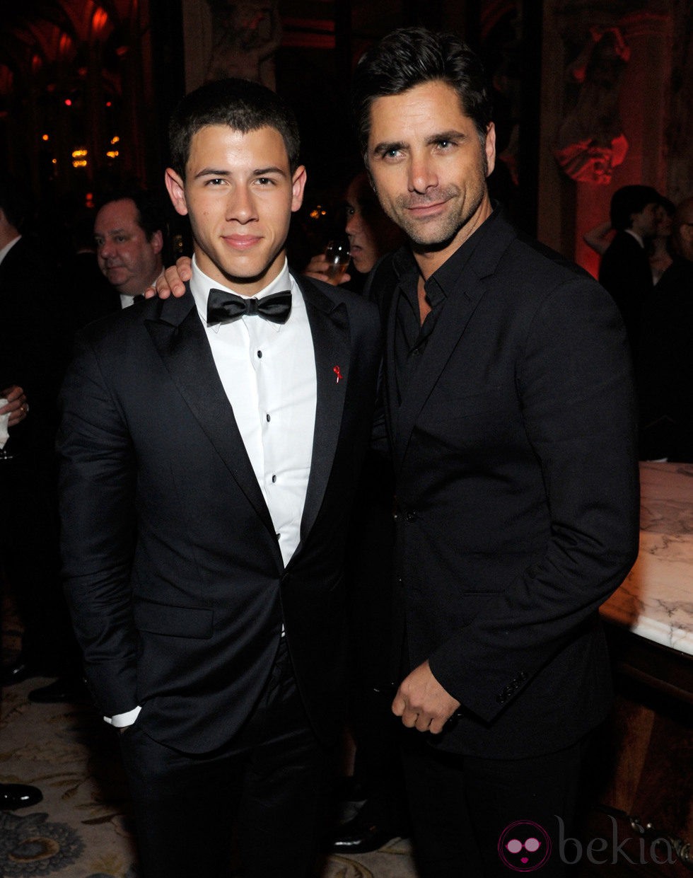 Nick Jonas y John Stamos en los Premios Tony 2012