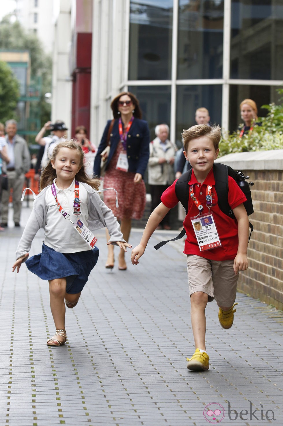 Christian e Isabel de Dinamarca corren para llegar a una recepción en Londres 2012