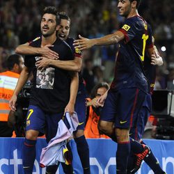 Jordi Alba y Sergio Busquets con David Villa su gol contra la Real Sociedad