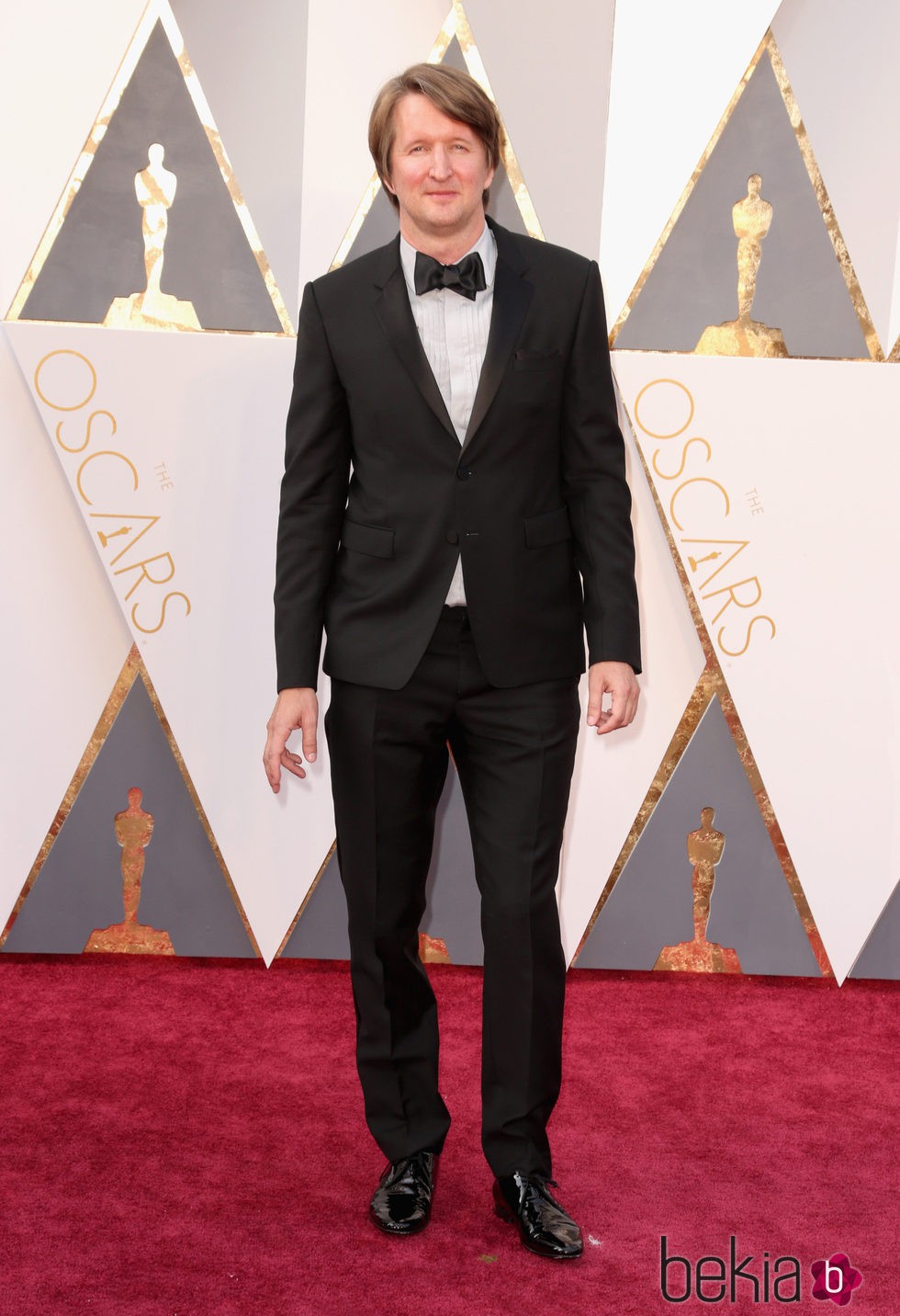 Tom Hooper en la alfombra roja en los Premios Oscar 2016